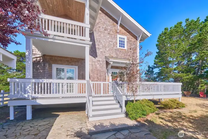 Ground floor deck leads to the back yard.