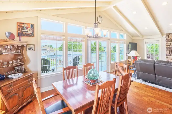 Dining area with slider to top floor deck and incredible sunset views over the ocean!