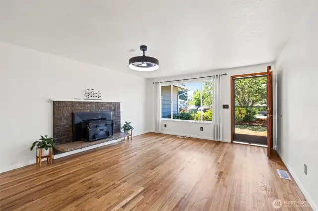 Living room with wood burning fire place.