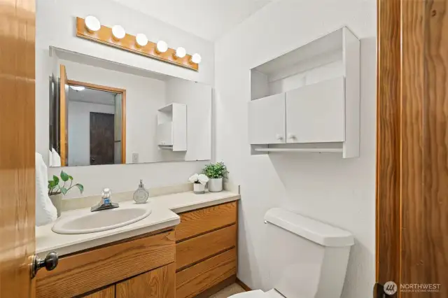 Half bath located in the bonus room.