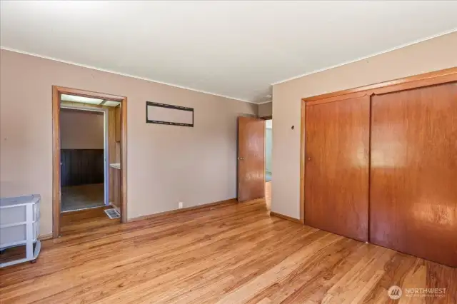 Second view of primary.  Hardwood flooring is in good condition.