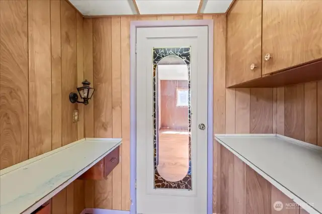 Additional storage space and cut through to second bedroom.