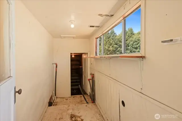 Laundry room off of kitchen.