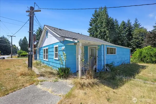 View of kitchen entry from driveway.  Door to the left is kitchen, door to the right is laundry and storage.