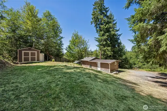 Well house with exterior water hookup for RV. Electrical hookup is at the corner of the home as well as on the well house. Easy to extend RV dump to septic at the corner of the home.