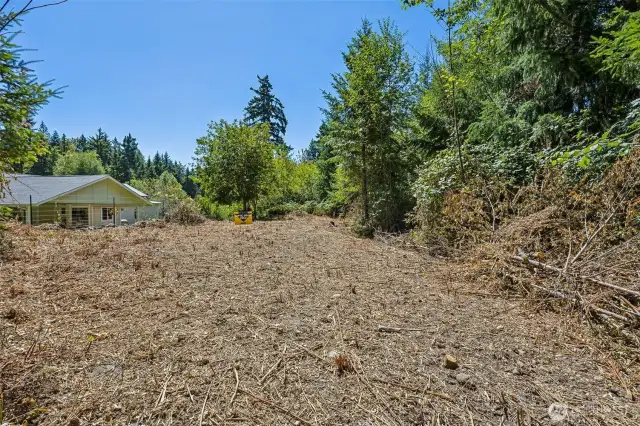 Septic drain field is at the top of the property line.