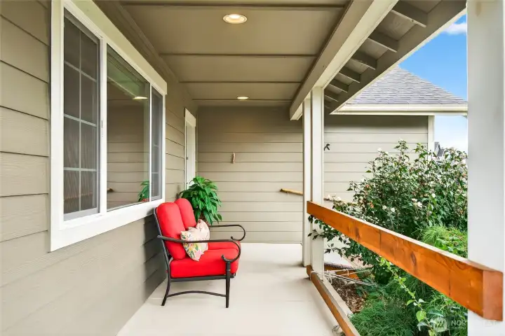 Large front porch with mature plantings in the front yard. A nice place to sit and relax.