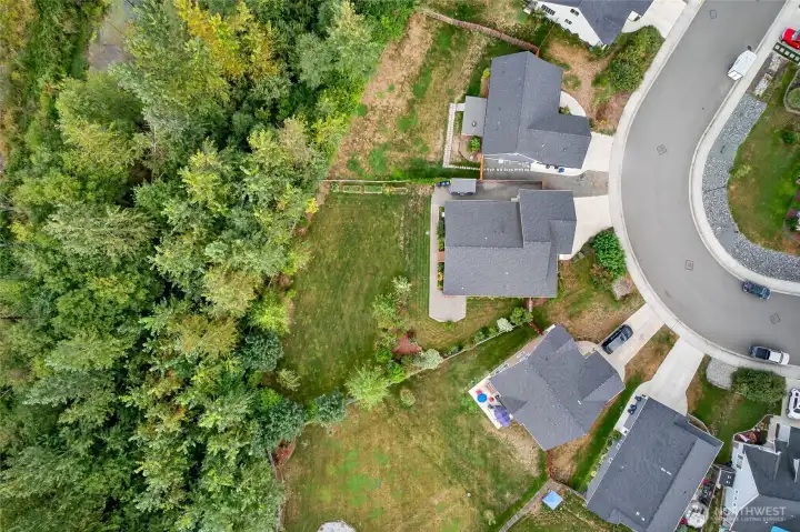 921 Whispering Meadows is second from the top with the large deck and huge yard backing to treed green space.