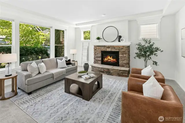 A stone fireplace anchors this room offering warmth and a place to gather.