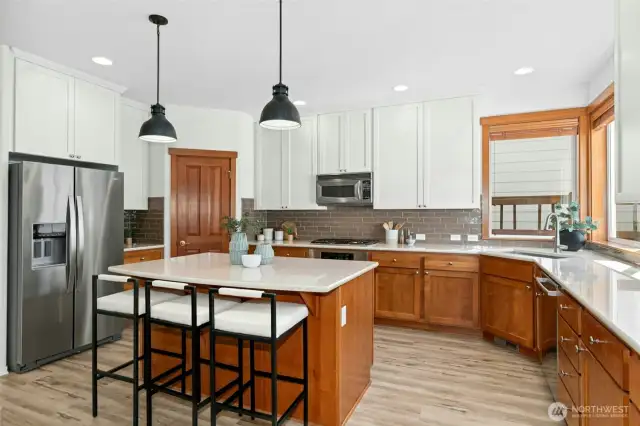 The sellers also added new drop lighting that connects well with other  lighting in the adjoining rooms.