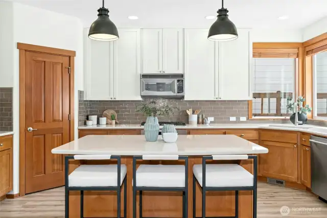 Perfect amount of space for a large island and seating for guests or the homework crew to hang while you cook.
