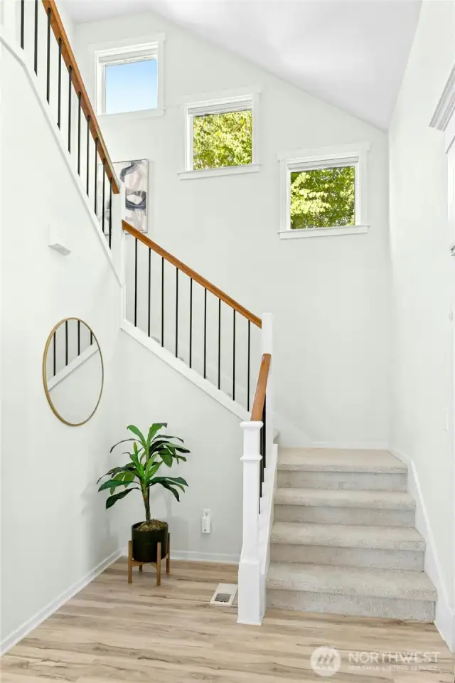 The staircase to the upstairs is a classic beauty - light filled windows grace the way up!