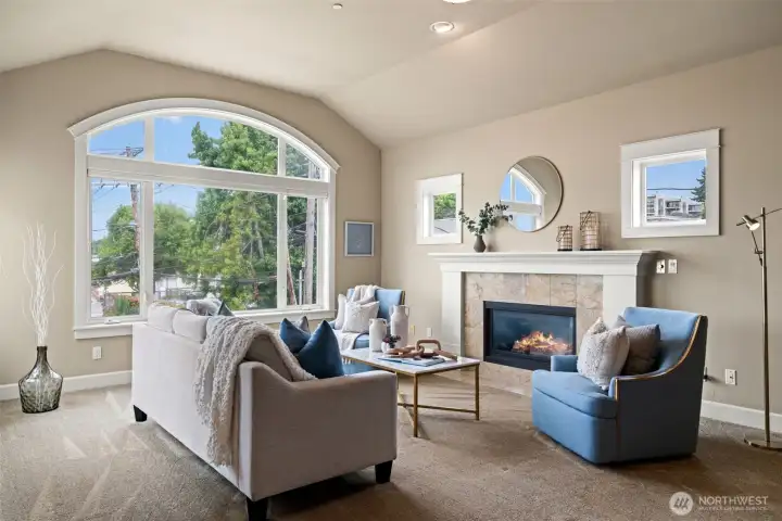 Open living room with fireplace.