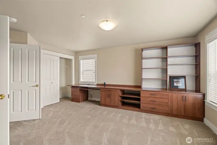 Third bedroom currently used as an office space. Custom built-in California Closet cabinetry.