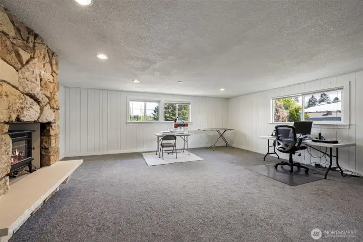 Huge rec room with a wood burning fireplace over the garage! This is the only room not on the main level.