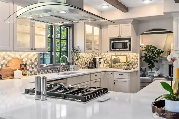 Enjoy cooking on gas stove and efficient overhead hood vent.