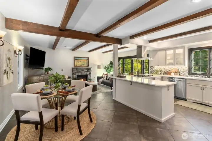 Crisp white quartz counters, quality cabinets and extra bar seating around the kitchen island.