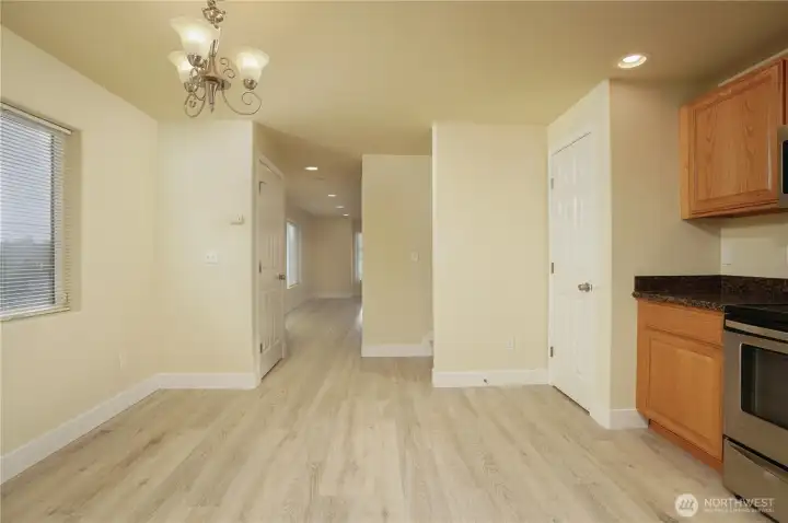 Kitchen leading to living room (Pantry and additional closet for storage)