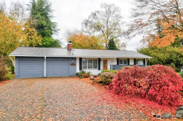 Front view with plenty of parking in the driveway