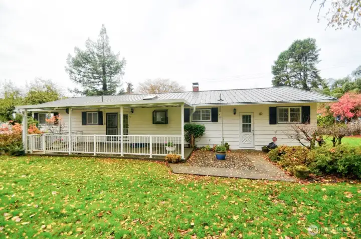 Back view showing covered patio