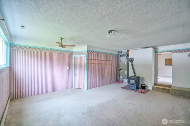 The garage was converted into a multiuse room that includes a cozy pellet stove