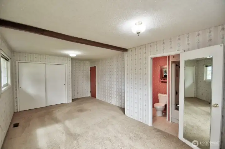 View of the primary suite showing the private full bath