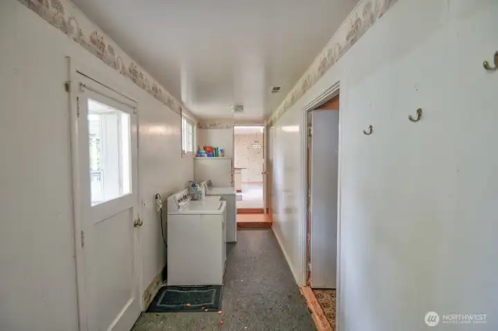 Just off the kitchen there is a large laundry room with storage, washer and dryer and storage with access to the back yard