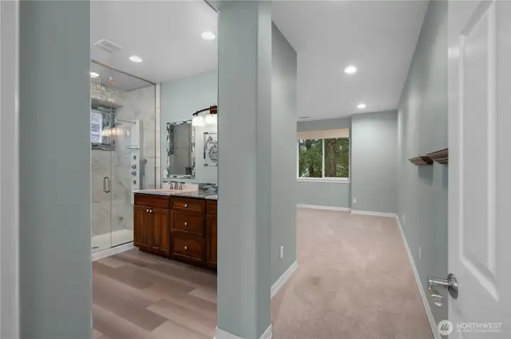 Serene primary bedroom featuring brand-new carpet with a plush memory foam pad, Roman blackout blinds, and peaceful golf course views framed by wooded privacy a perfect retreat at the end of the day.