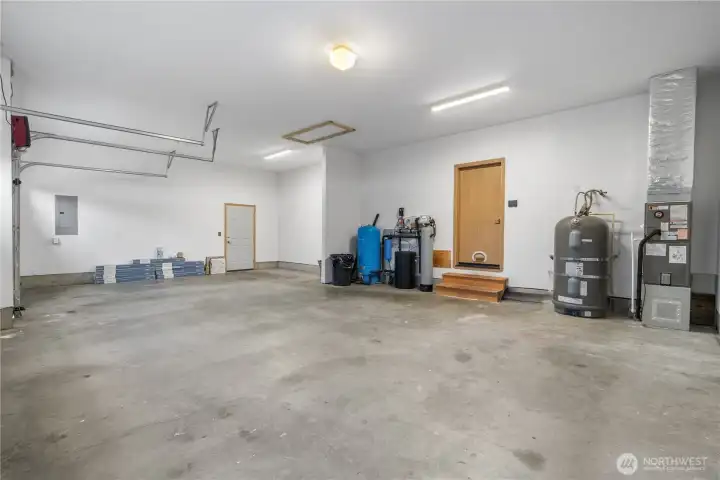 3-car attached garage exterior door leads to impressive shop