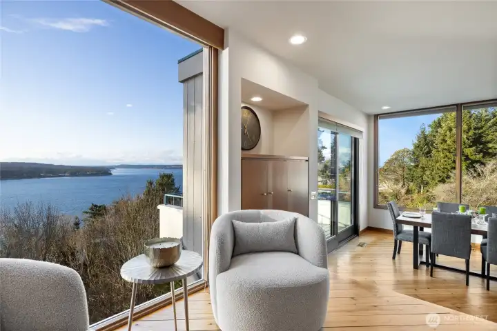 Living room with floor to ceiling windows.