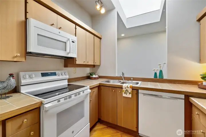 Light & bright kitchen with a huge skylight.