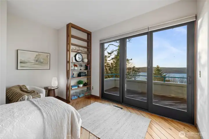 Connected to the Primary by a pocket door, this could be utilized as a bedroom or library/den & has the 2nd view deck.