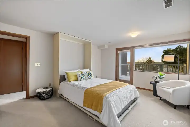 Lower level spacious bedroom with a door to the 3rd view deck.