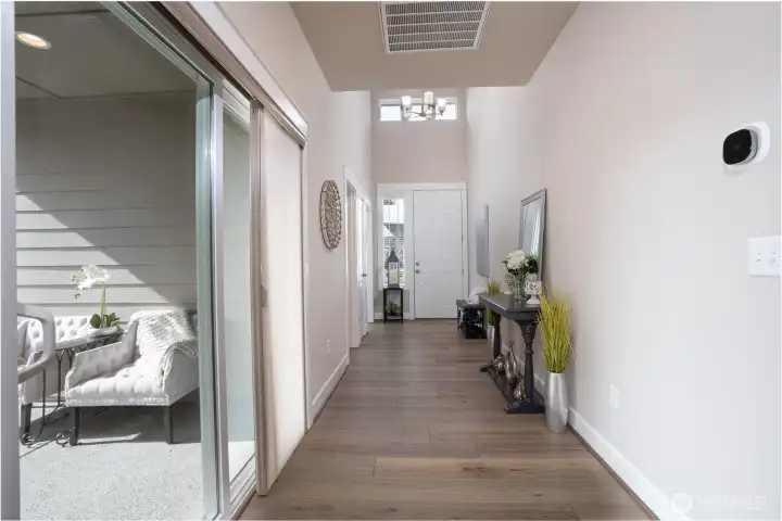 Off of the entry way is the first of two patios and this one is covered- making it the perfect spot to cozy up, even on our rainy days.  This is one of the few homes in Ovation to have two patios- these sellers knew what they were doing and what they wanted- you'll thank them for their great planning.