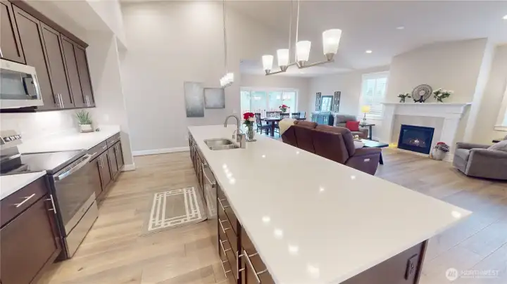 The slab quartz kitchen island/bar is glorious- perfect for prepping meals, bellying up to the bar and visiting, or informal dining.