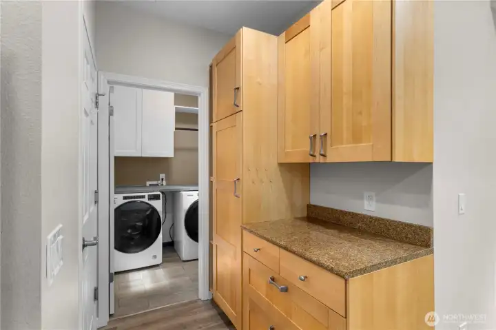 Here's another part of the kitchen with a computer desk. Garage is to the left and laundry room straight ahead.