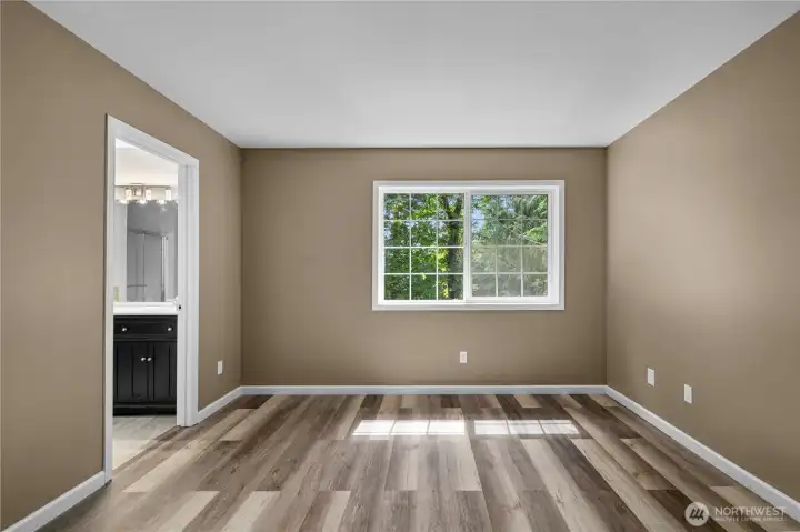 Primary bedroom with its own bath located on the back side of the house.