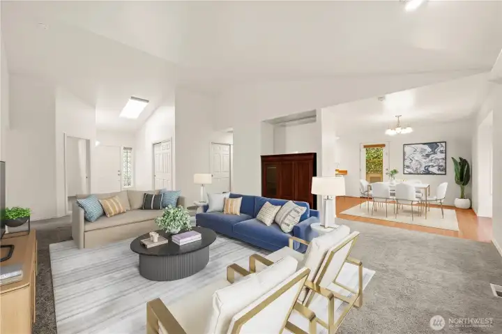 Virtually staged open living room with vaulted