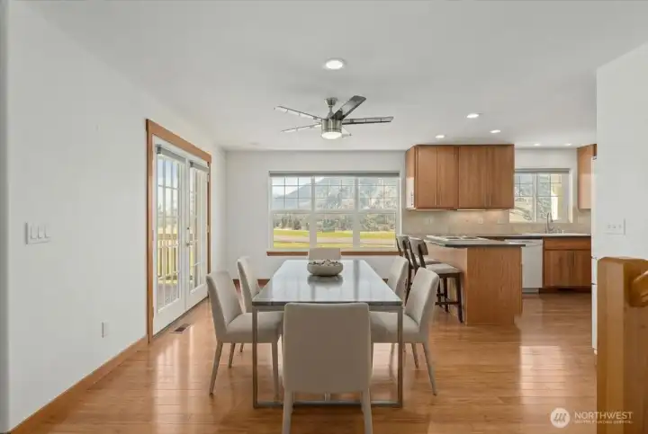 Virtually Staged Dining Room open to the living and kitchen