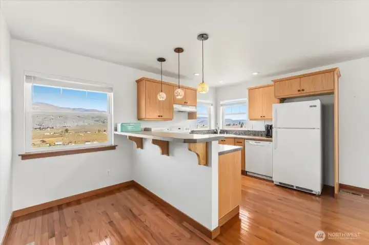 Kitchen in living space above the shop with bar style seating