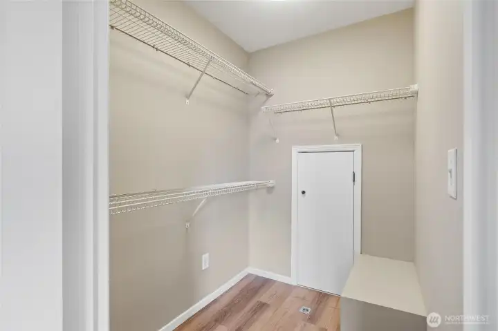 Sizable Walk-in Closet & more storage through the small door.