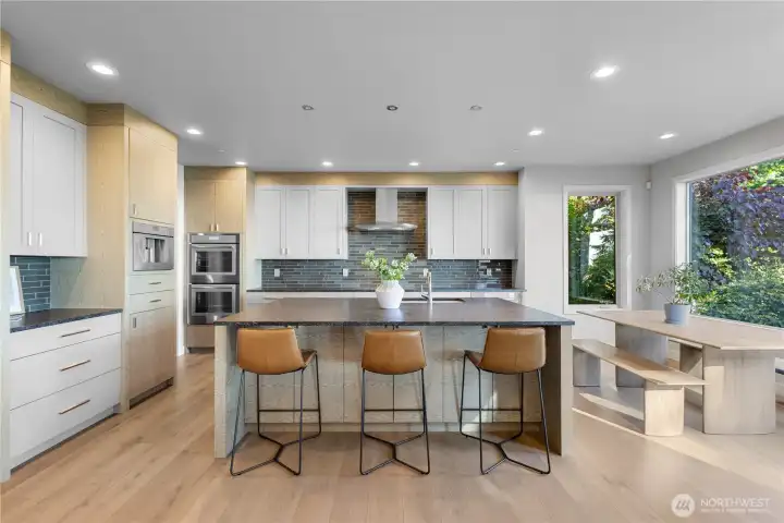 A professional-grade kitchen designed for the culinary enthusiast, featuring top-tier appliances and an expansive layout.