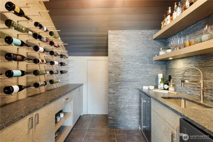 Bring the tasting room experience home with a professionally chilled cellar just steps from the kitchen island.