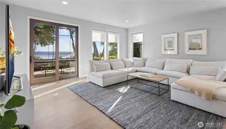 This expansive living area offers endless possibilities, from a sophisticated media room to a private secondary lounge.