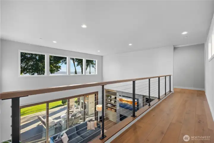 The open-rail design ensures a seamless visual flow between floors, keeping the home feeling connected and incredibly bright.