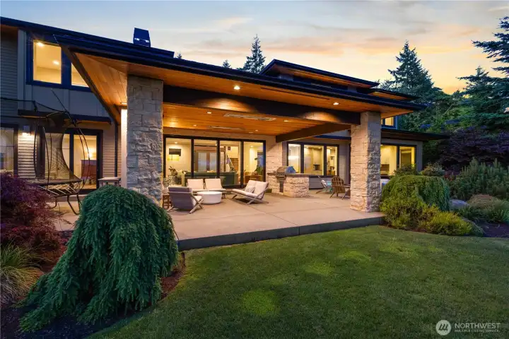 Equipped with integrated ceiling heaters and a roaring stone fireplace, this covered sanctuary ensures outdoor entertaining remains a luxury through every season.