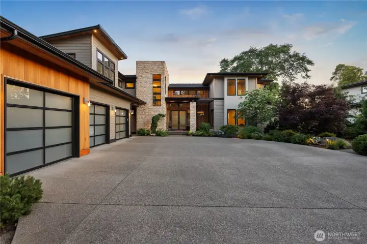 This dramatic evening perspective showcases the home's grand scale and the meticulous attention to detail that defines every inch of the estate.
