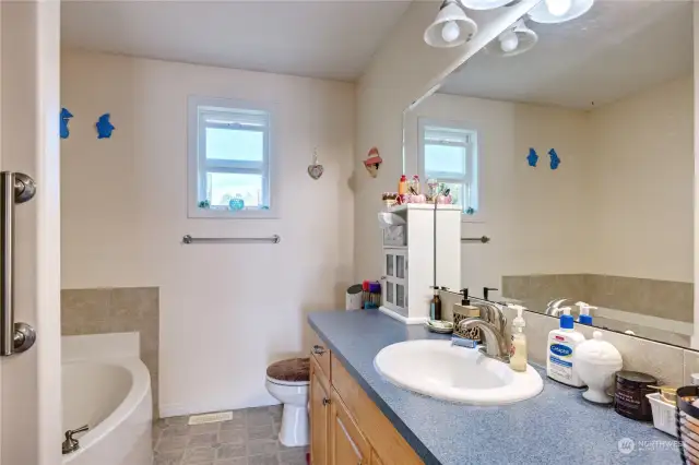 Full bath with separate tub and shower
