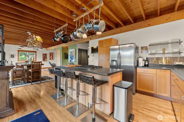 Chefs Kitchen has a food gallery island to this great kitchen. All appliances stainless steel. Custom wood cabinets. Hardwood floors. Wine cooler. Propane Range and oven.