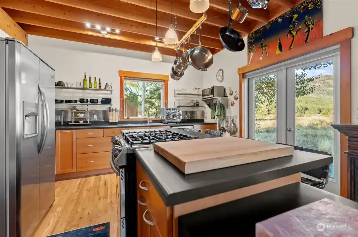 Kitchen has ample counter top areas for working on good food for friends and guests!